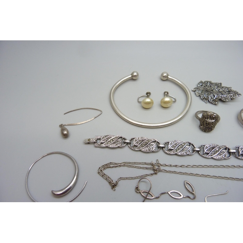 7091 - A collection of silver and other jewellery, torque bangle, rings, etc.