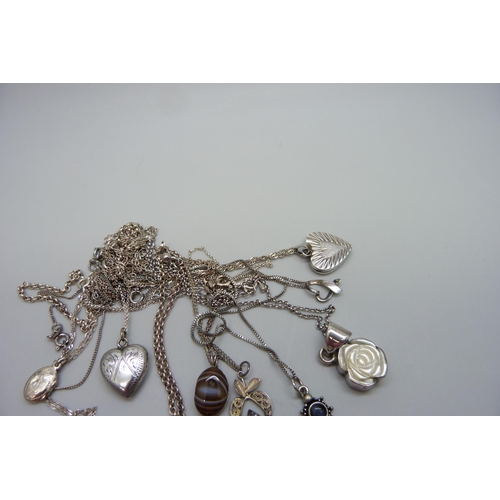 7092 - Ten silver pendants and chains including a hallmarked Victorian silver locket