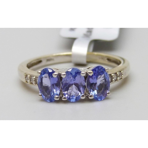 7105 - A silver gilt tanzanite and topaz ring, P