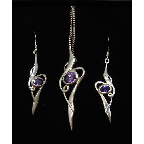 7110 - A silver and amethyst pendant and matching earrings