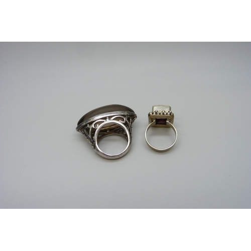 7112 - A large hallmarked silver ring and one other ring, both size N