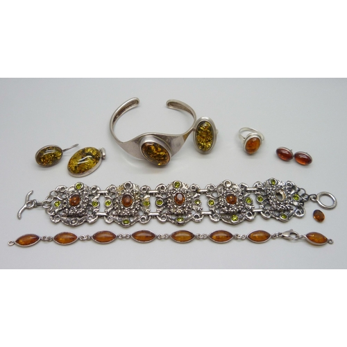 7119 - Two silver and amber set rings, other amber set jewellery and a costume bracelet with loose stone