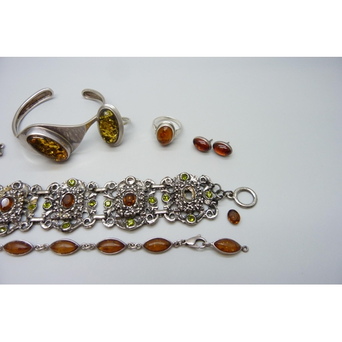 7119 - Two silver and amber set rings, other amber set jewellery and a costume bracelet with loose stone