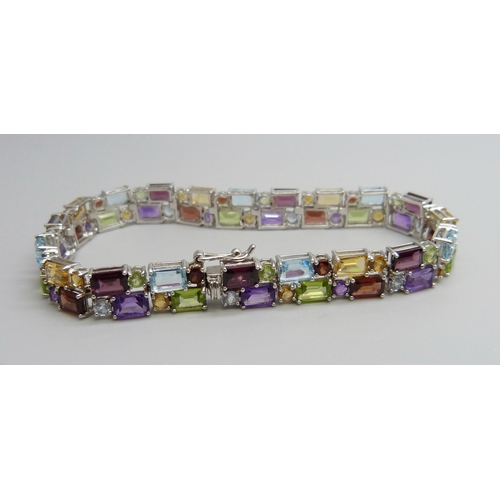 7144 - A silver multi-gem set bracelet