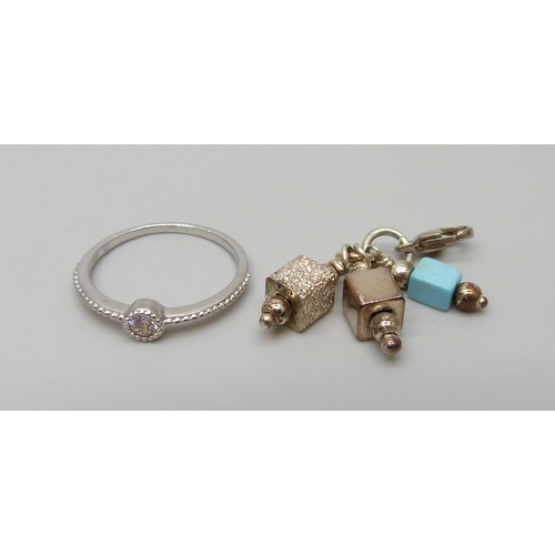 7147 - A silver ring and clip on charm, 4.5g