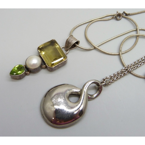 7156 - A silver stone set pendant, one other pendant and two silver chains