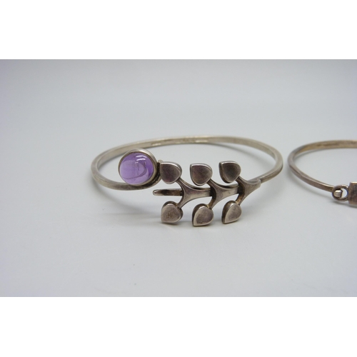 7160 - A Swedish silver bangle set with a cabochon amethyst by Borgila and one other silver bangle, (Borgil... 