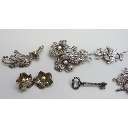 7162 - A 1950s hallmarked silver and paste set spray brooch, London 1955, and a collection of silver and ma... 