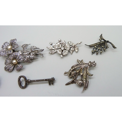 7162 - A 1950s hallmarked silver and paste set spray brooch, London 1955, and a collection of silver and ma... 