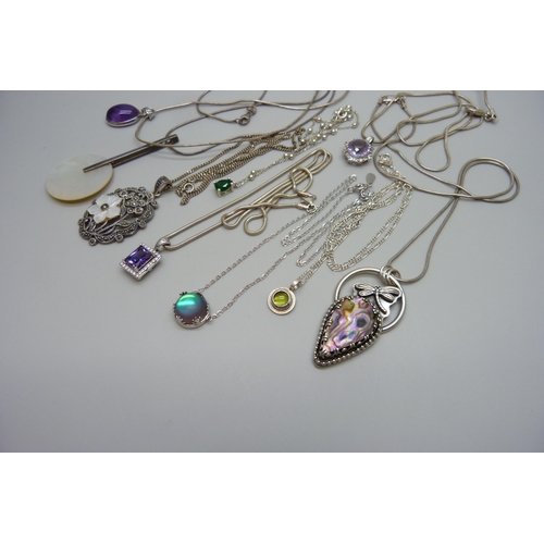 7169 - Nine silver pendants and chains