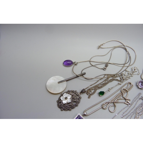 7169 - Nine silver pendants and chains