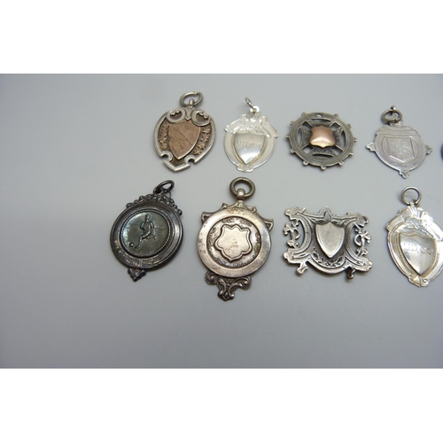 7170 - A collection of silver fob medals including one football, 44g