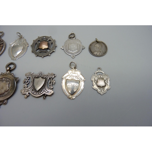 7170 - A collection of silver fob medals including one football, 44g