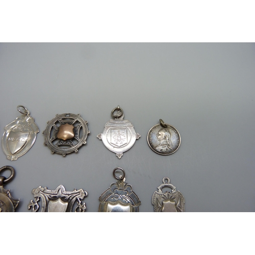 7170 - A collection of silver fob medals including one football, 44g