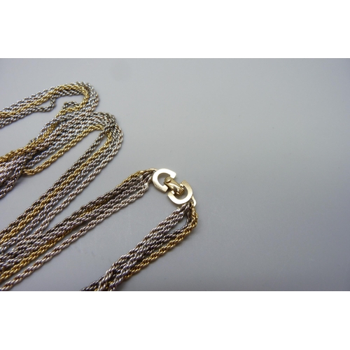 7183 - A long Christian Dior four-strand necklace, 90cm/36''