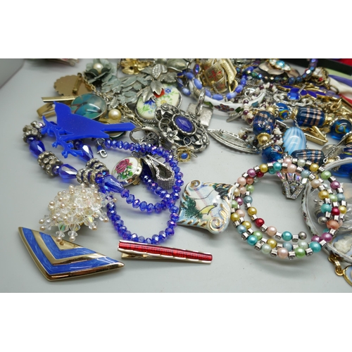 7234 - A collection of costume jewellery including brooches, cufflinks, necklaces, bangles, etc.