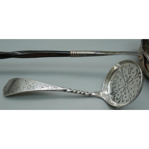 7336 - A silver sifter spoon, 23g, and a toddy ladle inset with a George III silver coin and with baleen ha... 