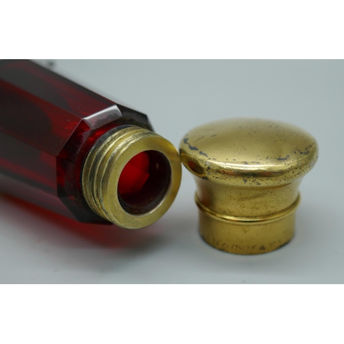 7340 - A gilt metal mounted ruby glass double scent bottle, marked Mordan in one lid, 122mm