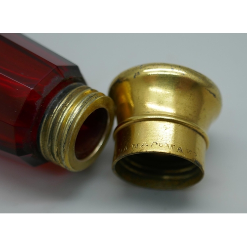 7340 - A gilt metal mounted ruby glass double scent bottle, marked Mordan in one lid, 122mm