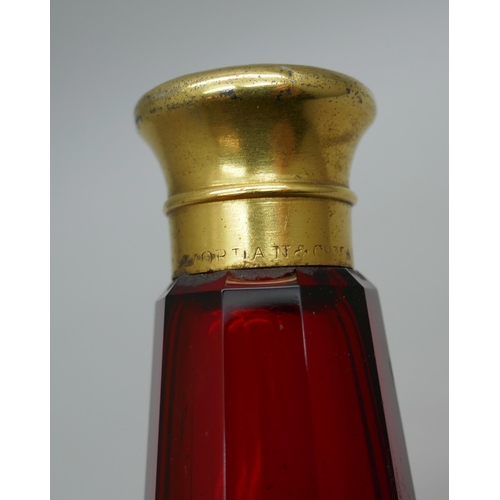 7340 - A gilt metal mounted ruby glass double scent bottle, marked Mordan in one lid, 122mm