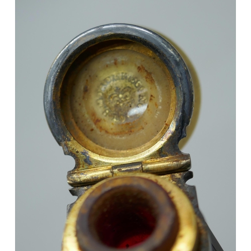 7340 - A gilt metal mounted ruby glass double scent bottle, marked Mordan in one lid, 122mm