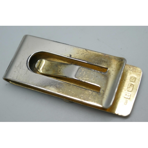 7345 - A silver gilt money clip, 21g