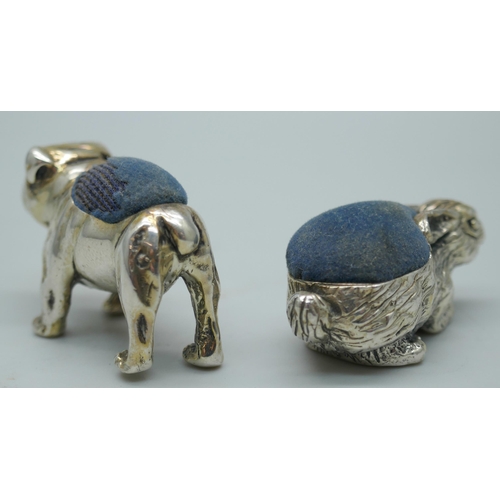 7348 - Two small novelty silver pin cushions, rabbit and bull-dog