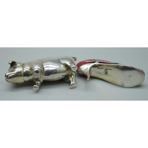 7349 - Two small novelty silver pin cushions, pig and lady's shoe