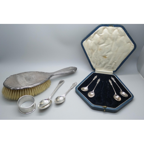 7354 - Two silver spoons, a silver napkin ring, a cased set of four silver spoons, (lacking two), and a sil... 