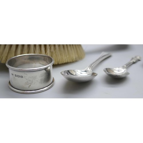 7354 - Two silver spoons, a silver napkin ring, a cased set of four silver spoons, (lacking two), and a sil... 