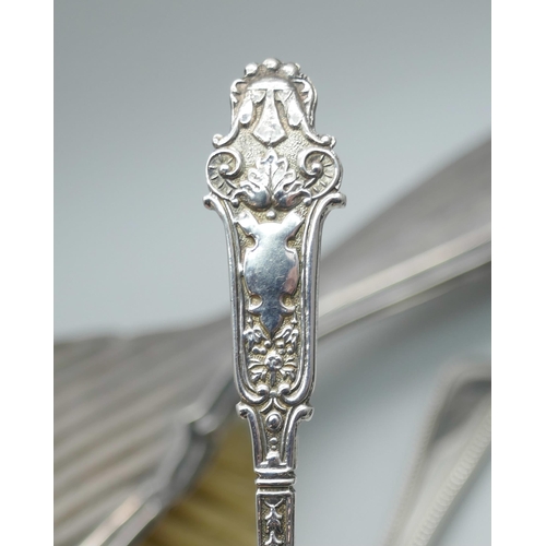 7354 - Two silver spoons, a silver napkin ring, a cased set of four silver spoons, (lacking two), and a sil... 