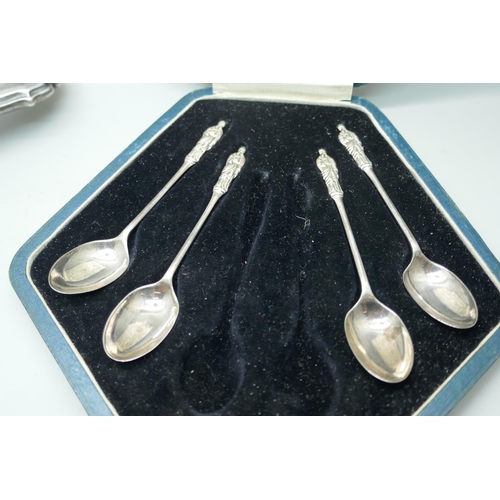 7354 - Two silver spoons, a silver napkin ring, a cased set of four silver spoons, (lacking two), and a sil... 