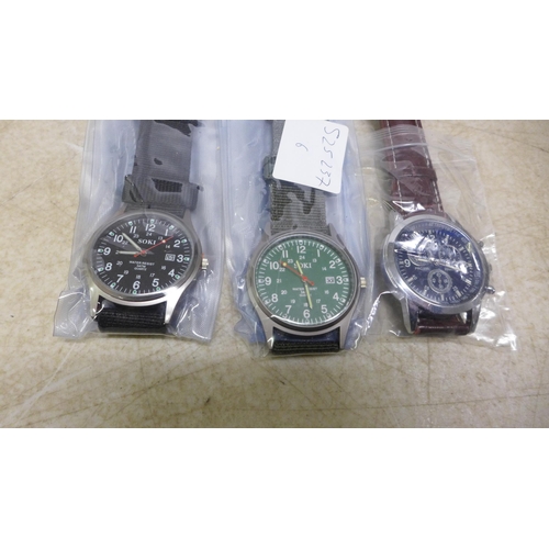 5076 - 9 assorted gentleman's wristwatches, all packaged and unused