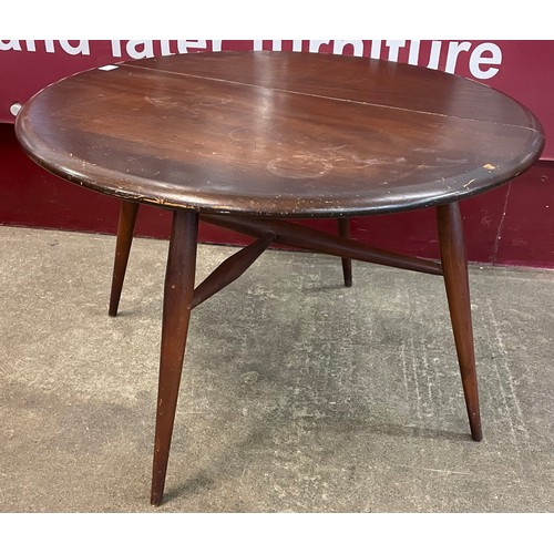 82 - An Ercol Golden Dawn elm and beech 308 model drop leaf coffee table