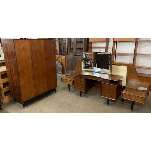 83A - A G-Plan Librenza tola wood and black bedroom suite, comprising; wardrobe, dressing table and headbo... 