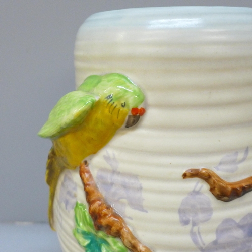 2004 - A Clarice Cliff Newport Pottery vase decorated with parrots, 21cm