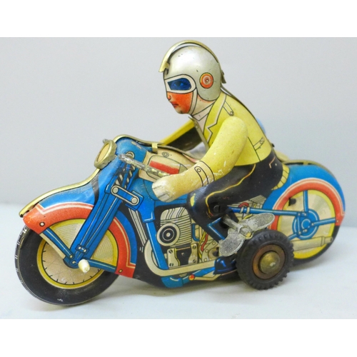 2030 - A vintage tin plate clockwork motorcycle and sidecar