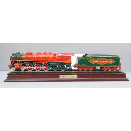 2042 - A Franklin Mint precision model - North Pole Ltd train and tender on display track