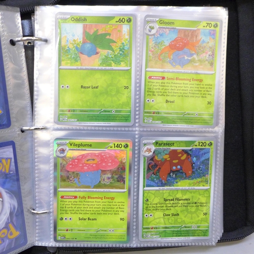 2043 - A full binder of scarlet and violet 151 part set of Pokémon cards, part set includes 105 holographic... 