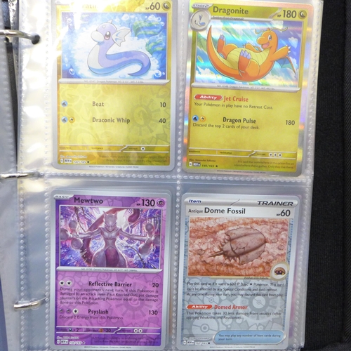 2043 - A full binder of scarlet and violet 151 part set of Pokémon cards, part set includes 105 holographic... 