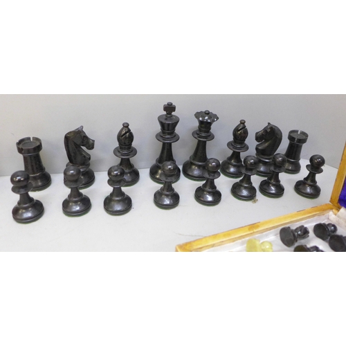 2060 - A wooden chess set, height of king 88mm, a carved stone chess set and board and one other travel set... 