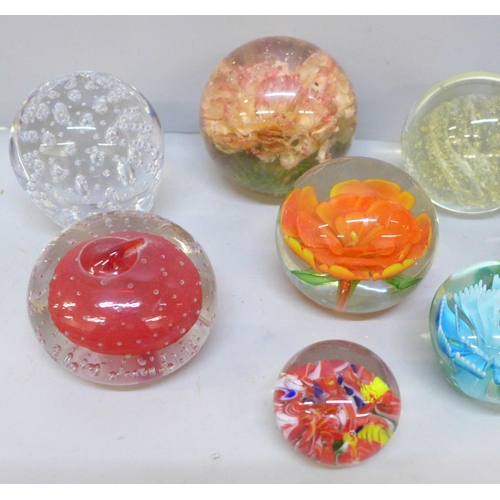 2065 - A box of eleven glass paperweights