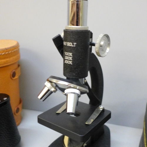 2070 - A Skybolt microscope and a pair of Lichter 8x30 binoculars, cased