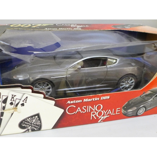 2081 - Two James Bond 007 Joyride cars, Casino Royale Aston Martin DBS and 1965 Aston Martin Goldfinger, bo... 