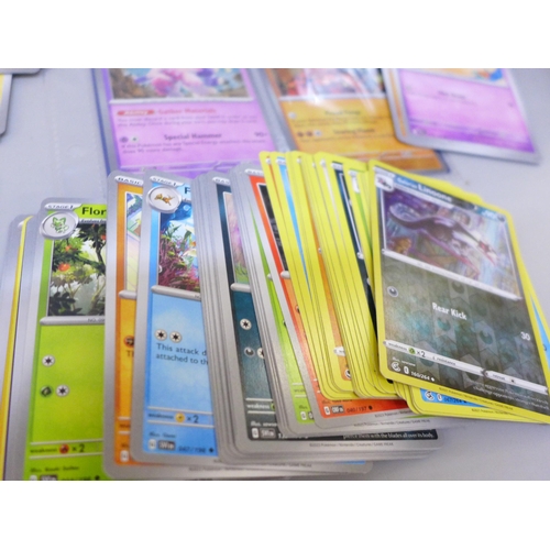 2090 - A box of over 600 Pokémon cards including holographic and rare cards with a large promo card