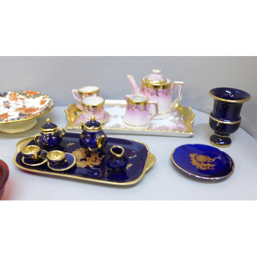 2092 - A box of miniature tea sets and other miniature porcelain