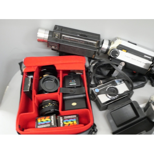 2120 - A collection of camera equipment including Olympus, Panasonic and camcorders