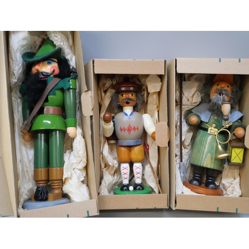 2127 - A collection of carved traditional German figures including 'Robin Hood' nut cracker, other nut crac... 