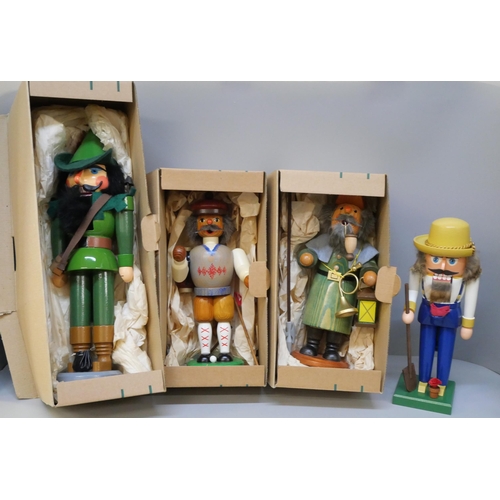 2127 - A collection of carved traditional German figures including 'Robin Hood' nut cracker, other nut crac... 