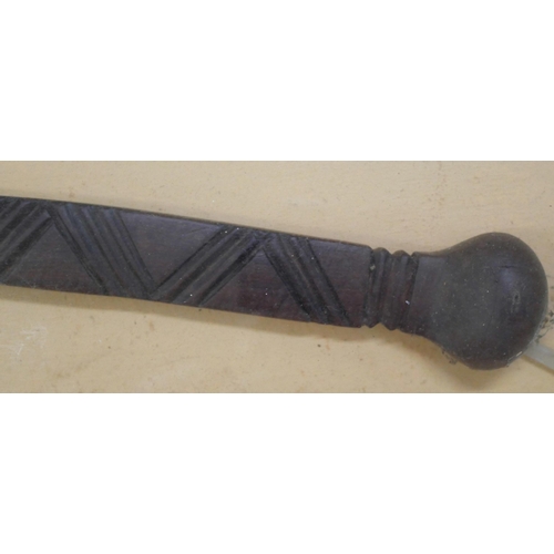 2160 - A tribal fighting stick in a presentation glass fronted case